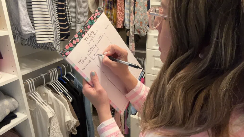Woman demonstrating outfit formula with layering piece, accessories, and shoes