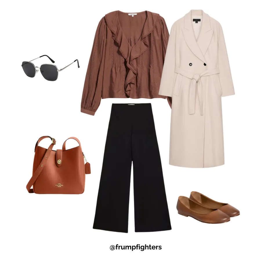 Brown blouse with black wide leg pants, long coat and flats styled as a chic winter work outfit